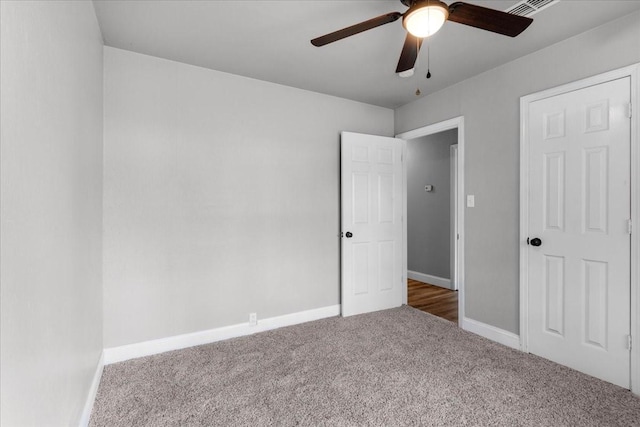 736 W Bullock Dr, Denison, TX 75020 - unfurnished bedroom with carpet, baseboards, and ceiling fan