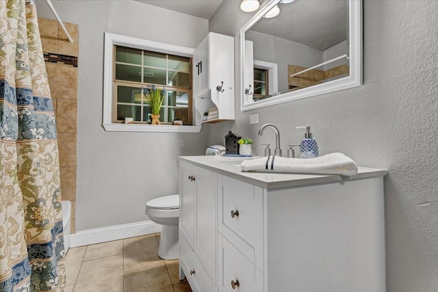 736 W Bullock Dr, Denison, TX 75020 - full bathroom featuring vanity, toilet, tile patterned flooring, shower / tub combo, and baseboards