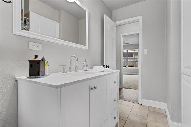 736 W Bullock Dr, Denison, TX 75020 - bathroom featuring vanity, baseboards, and tile patterned floors