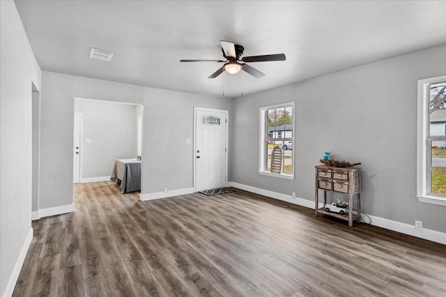 736 W Bullock Dr, Denison, TX 75020 - unfurnished living room featuring a ceiling fan, dark wood finished floors, and baseboards