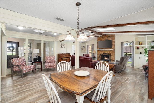1 Cedar Bend Trl, Lucas, TX 75002 - dining room with a fireplace, ceiling fan, and light wood-style floors