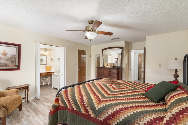 1 Cedar Bend Trl, Lucas, TX 75002 - bedroom featuring light wood finished floors, ensuite bathroom, a textured ceiling, and ceiling fan