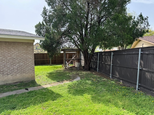 view of yard with a fenced backyard
