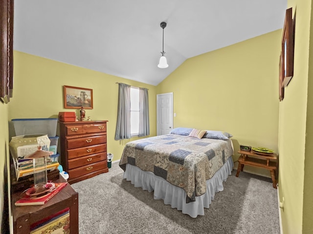 carpeted bedroom featuring baseboards and vaulted ceiling