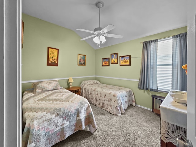 bedroom featuring lofted ceiling, carpet floors, baseboards, and a ceiling fan