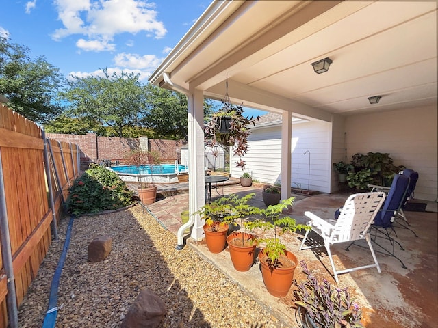 view of patio / terrace with a fenced in pool and a fenced backyard
