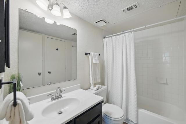 5912 Oregon Trl Ct, Haltom City, TX 76148 - bathroom featuring a textured ceiling, visible vents, toilet, vanity, and a textured wall