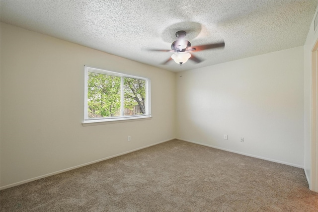 5912 Oregon Trl Ct, Haltom City, TX 76148 - carpeted empty room featuring a ceiling fan, baseboards, and a textured ceiling
