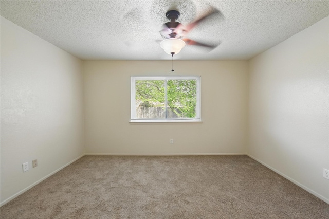 5912 Oregon Trl Ct, Haltom City, TX 76148 - carpeted spare room with a textured ceiling, baseboards, and ceiling fan