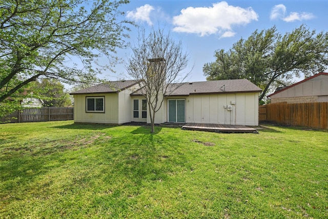 5912 Oregon Trl Ct, Haltom City, TX 76148 - rear view of house featuring a wooden deck, a fenced backyard, and a lawn