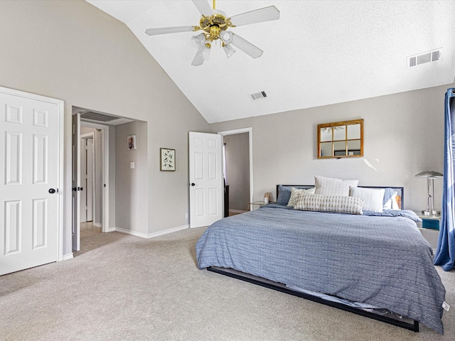 bedroom with carpet flooring, high vaulted ceiling, visible vents, and baseboards