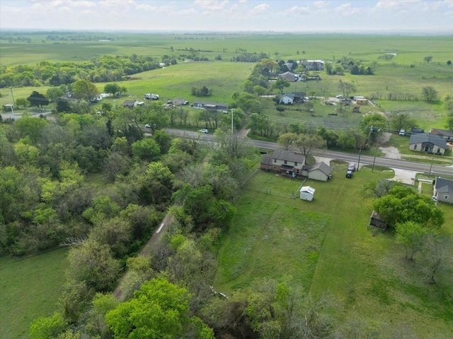 birds eye view of property with a rural view