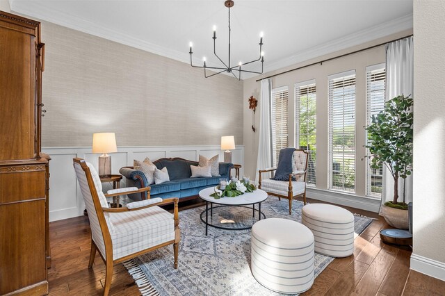 7501 Kickapoo Dr, Mckinney, TX 75070 - living room featuring wainscoting, a chandelier, ornamental molding, and wood finished floors
