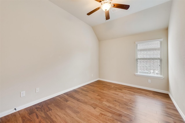 9836 Arctic Dr, Frisco, TX 75035 - empty room with a ceiling fan, lofted ceiling, baseboards, and light wood-type flooring