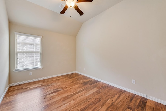 9836 Arctic Dr, Frisco, TX 75035 - empty room featuring ceiling fan, light wood-style floors, vaulted ceiling, and baseboards