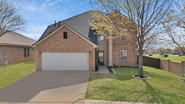 traditional-style house with concrete driveway, a garage, a front yard, brick siding, and a shingled roof