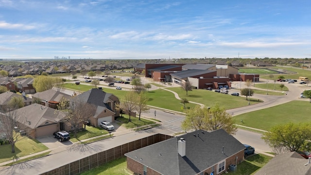 birds eye view of property with a residential view