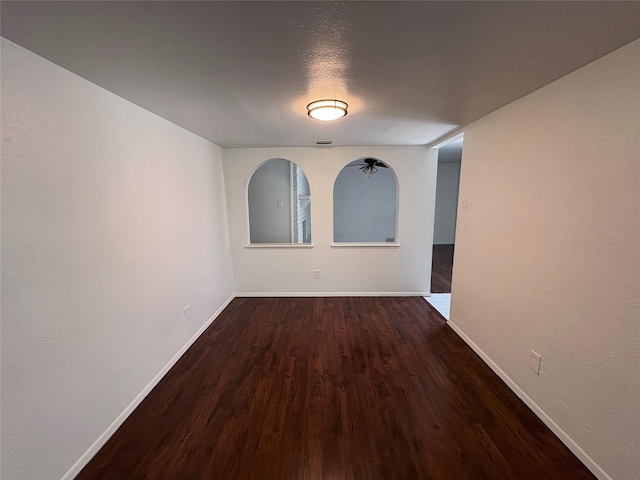 941 Overdowns Dr, Plano, TX 75023 - spare room featuring baseboards and dark wood finished floors