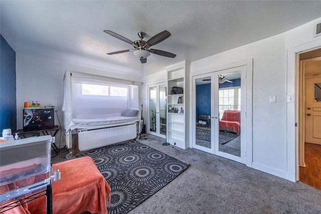 6110 Caracas Dr, Dallas, TX 75232 - interior space featuring a textured ceiling, ceiling fan, visible vents, and two closets