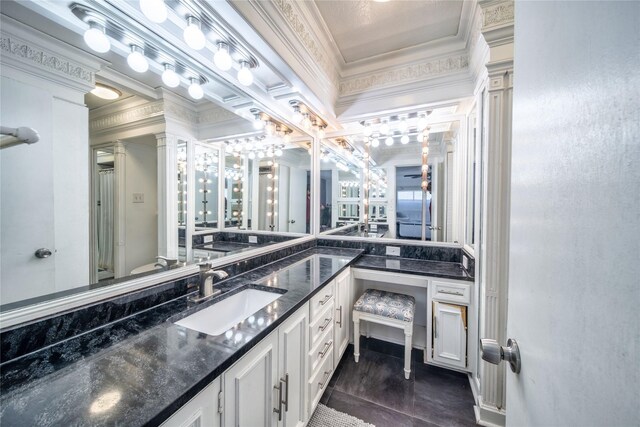 6110 Caracas Dr, Dallas, TX 75232 - full bath featuring decorative columns, toilet, vanity, and ornamental molding