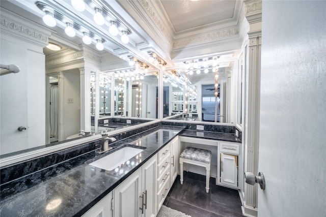 6110 Caracas Dr, Dallas, TX 75232 - bathroom featuring ornamental molding, vanity, and ornate columns