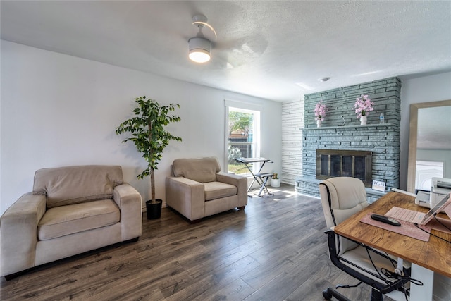 6110 Caracas Dr, Dallas, TX 75232 - living area with a fireplace, wood finished floors, and a textured ceiling
