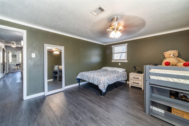 6110 Caracas Dr, Dallas, TX 75232 - bedroom with a textured ceiling, visible vents, crown molding, baseboards, and wood finished floors