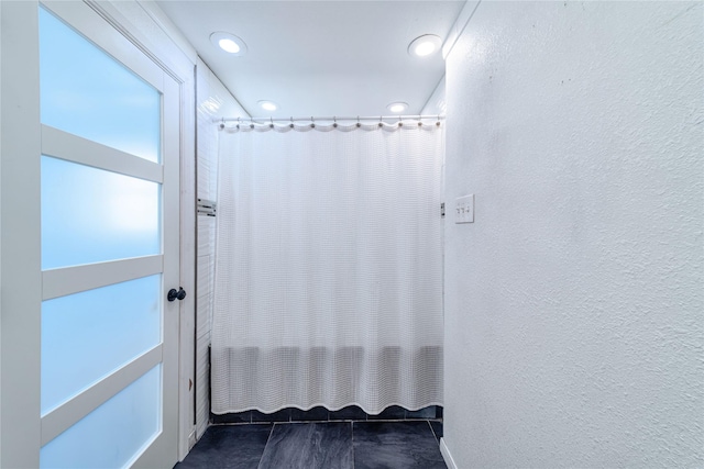 6110 Caracas Dr, Dallas, TX 75232 - full bath with a textured wall and recessed lighting