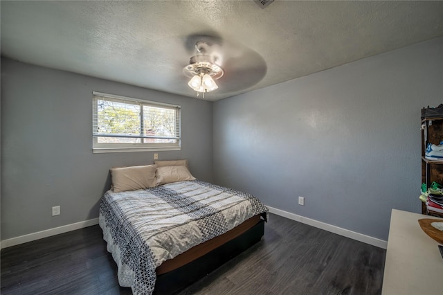 6110 Caracas Dr, Dallas, TX 75232 - bedroom with baseboards, a textured ceiling, and dark wood-style floors