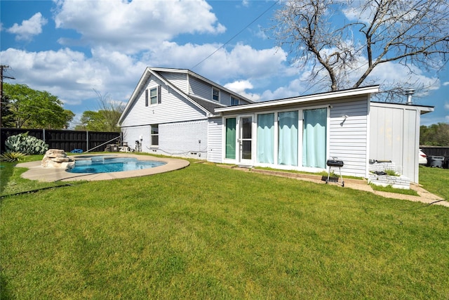 6110 Caracas Dr, Dallas, TX 75232 - back of house featuring fence, a fenced in pool, and a yard