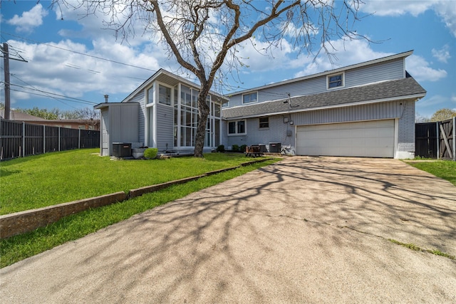 6110 Caracas Dr, Dallas, TX 75232 - view of front facade featuring fence, a garage, central AC, a front yard, and driveway