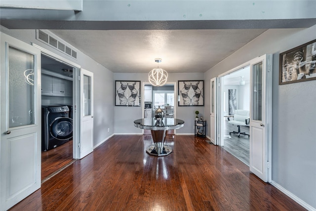 6110 Caracas Dr, Dallas, TX 75232 - dining room with dark wood-style flooring, baseboards, washer / dryer, visible vents, and a notable chandelier