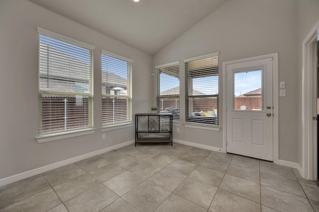 560 Camber St, Saginaw, TX 76131 - doorway with baseboards, light tile patterned flooring, and lofted ceiling