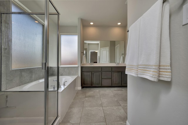 560 Camber St, Saginaw, TX 76131 - full bathroom featuring a garden tub, a shower stall, a sink, tile patterned floors, and double vanity
