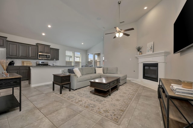 560 Camber St, Saginaw, TX 76131 - living area featuring visible vents, a ceiling fan, recessed lighting, high vaulted ceiling, and a glass covered fireplace