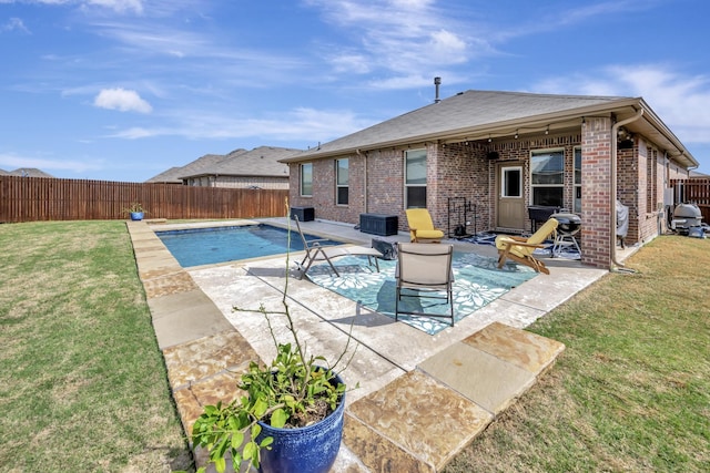 560 Camber St, Saginaw, TX 76131 - view of swimming pool with a fenced backyard, a fenced in pool, a patio, and a lawn