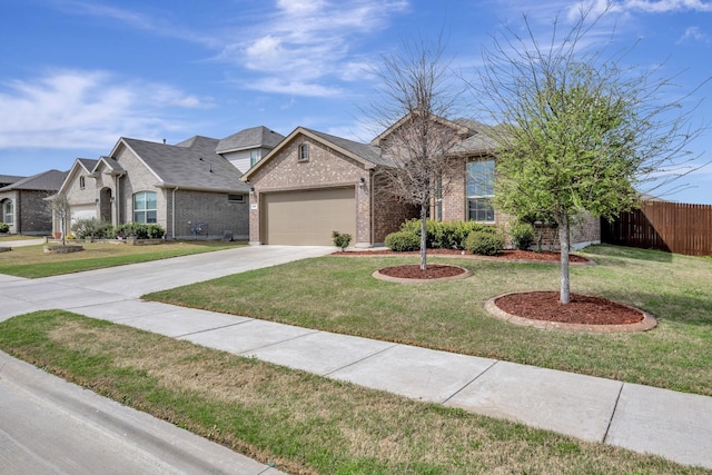 560 Camber St, Saginaw, TX 76131 - view of front of house with a front yard, fence, brick siding, an attached garage, and driveway