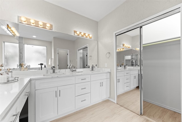 4730 Parkhaven Dr, Garland, TX 75043 - full bathroom with double vanity and a sink