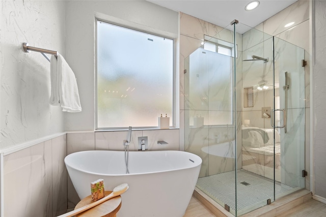 4730 Parkhaven Dr, Garland, TX 75043 - bathroom with recessed lighting, a soaking tub, and a shower stall