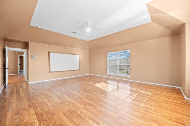 4730 Parkhaven Dr, Garland, TX 75043 - empty room with baseboards, ceiling fan, light wood-style flooring, and vaulted ceiling