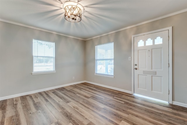 2823 Ingersoll St, Dallas, TX 75212 - entrance foyer featuring baseboards, wood finished floors, and crown molding