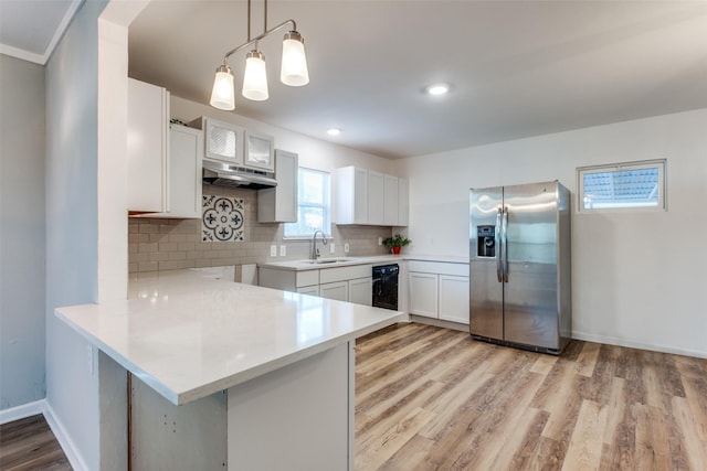 2823 Ingersoll St, Dallas, TX 75212 - kitchen featuring tasteful backsplash, stainless steel fridge with ice dispenser, a sink, light wood finished floors, and a peninsula