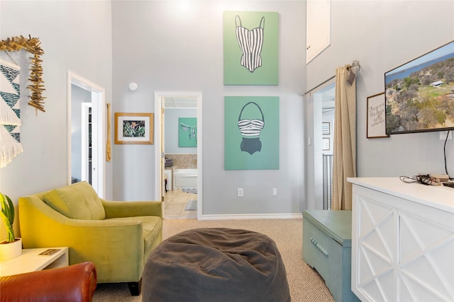 106 Gawayne Dr, Mabank, TX 75156 - living area featuring a towering ceiling, light carpet, and baseboards