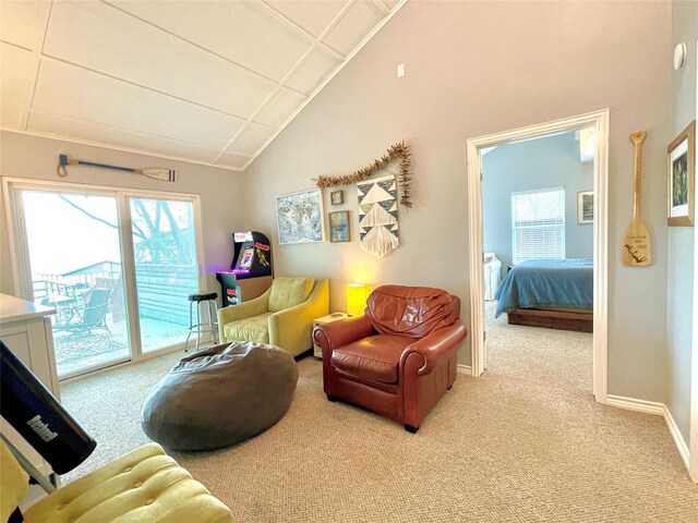 106 Gawayne Dr, Mabank, TX 75156 - living room with light carpet, a wealth of natural light, lofted ceiling, and baseboards