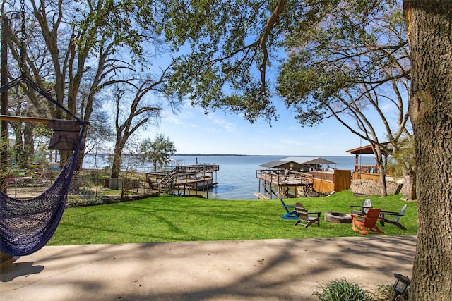 106 Gawayne Dr, Mabank, TX 75156 - dock area featuring a fire pit, a water view, and a yard
