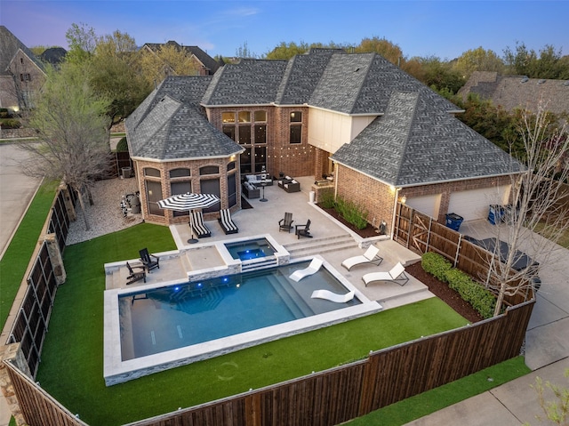 1715 San Jacinto Dr, Allen, TX 75013 - back of property with brick siding, a patio area, a shingled roof, a pool with connected hot tub, and an outdoor hangout area