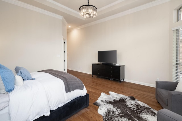 1715 San Jacinto Dr, Allen, TX 75013 - bedroom with a chandelier, wood finished floors, crown molding, baseboards, and a tray ceiling