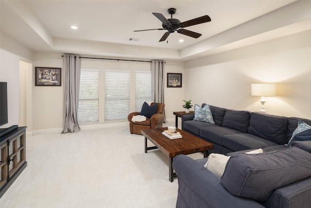 1715 San Jacinto Dr, Allen, TX 75013 - living area featuring a raised ceiling, a ceiling fan, baseboards, recessed lighting, and light colored carpet