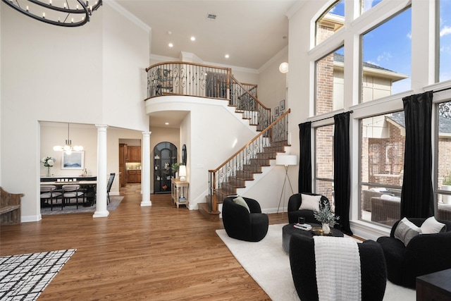 1715 San Jacinto Dr, Allen, TX 75013 - foyer entrance with a chandelier, decorative columns, a towering ceiling, baseboards, and ornamental molding
