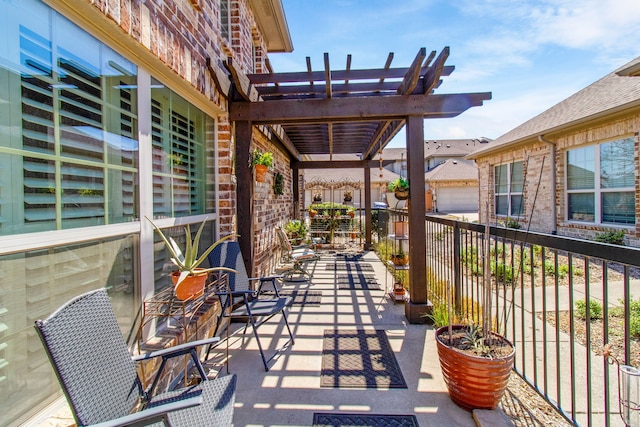 view of patio / terrace featuring a pergola and fence